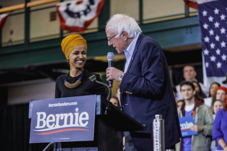 Representative Ilhan Omar with Senator Bernie Sanders at a campaign rally